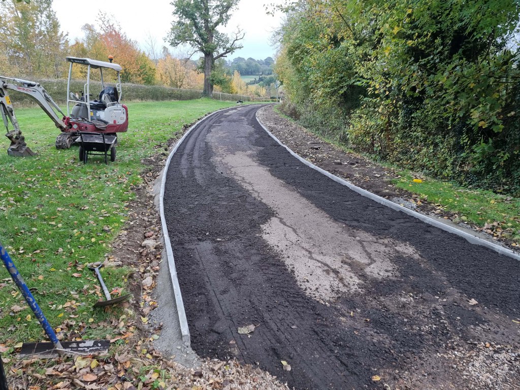 This is a large driveway which is in the process of having a tar and chip driveway installed on by Rochester Driveways